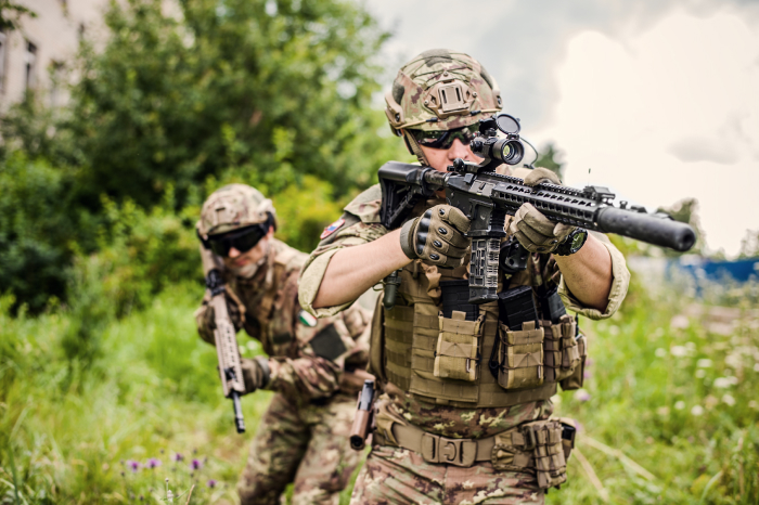 Two airsoft players in the meadow