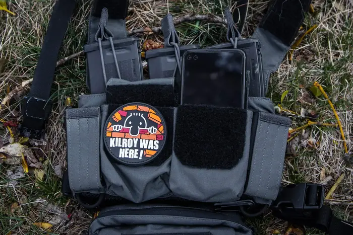 smartphone in tactical gear with patch